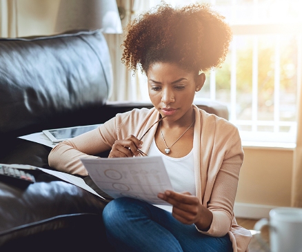 a woman viewing financial documents