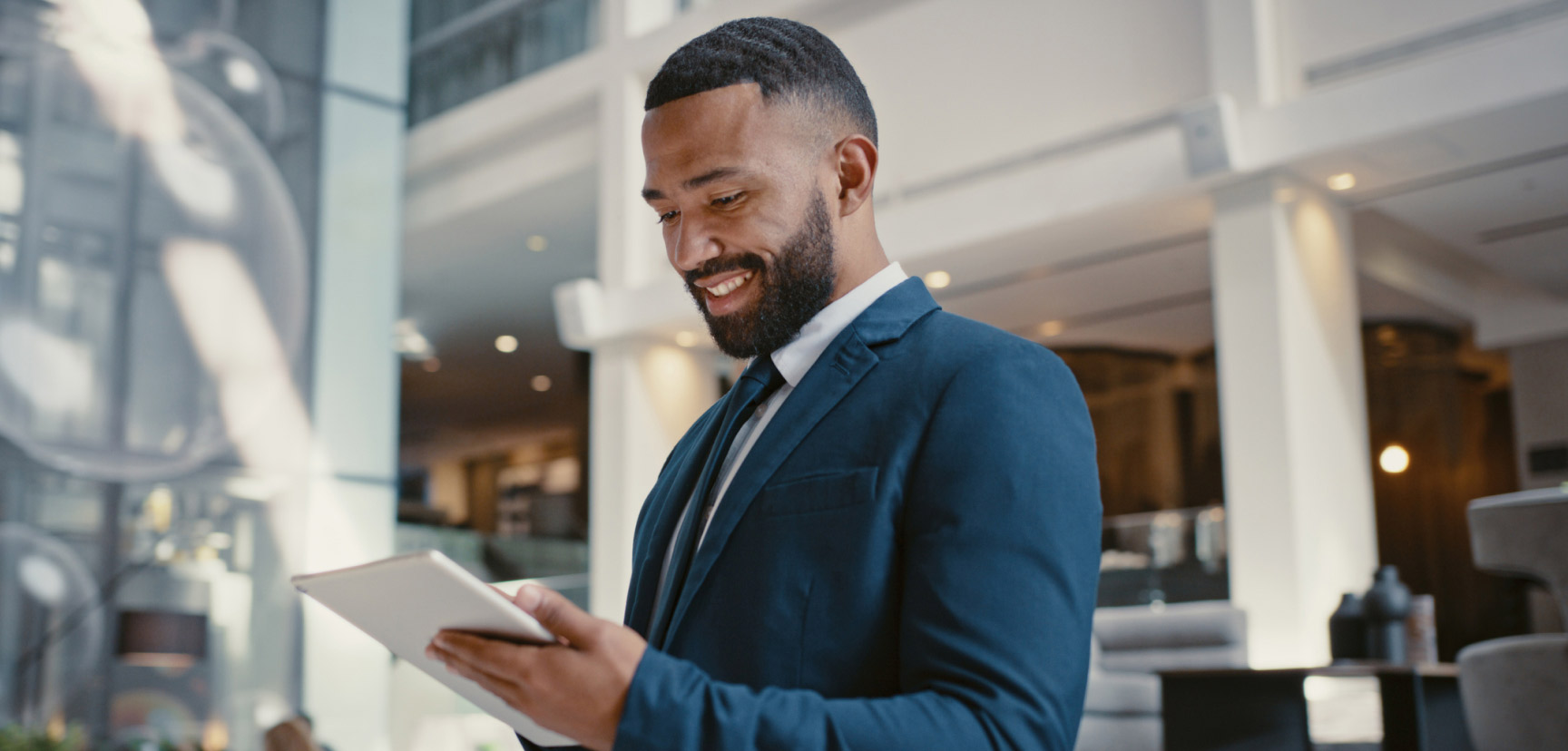 Business person looking at a tablet.