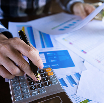 Business charts and a calculator.