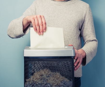 a person shredding papers