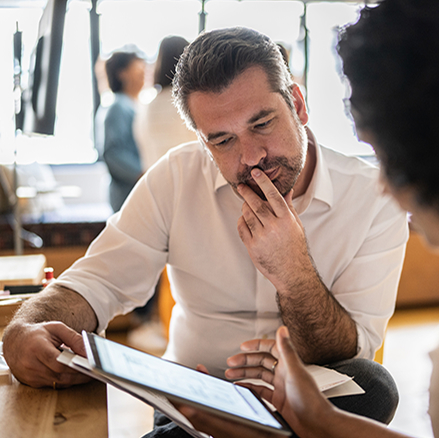 Small business people looking at a laptop.