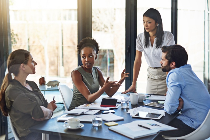 a group of employees discussing topics